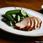 수면 질 향상을 위한 맞춤형 식단 - A cozy, softly lit kitchen scene in a modern Spanish home during evening time, featuring a wooden ta...